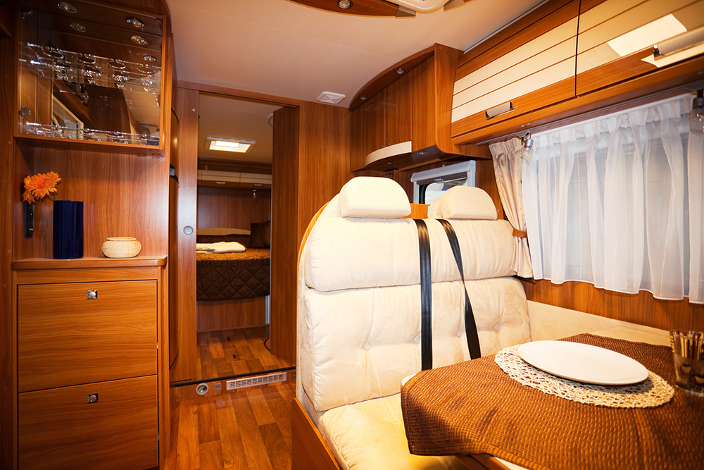 Motorhome Interior dining space and interior of a modern motorhome seen while preforming rv inspection services